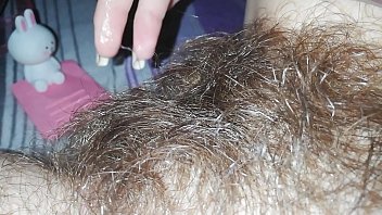 In Bed, A Quick Solo Session Brings A Close-up View Of A Hairy Pussy, A Big Clit Swelling, And The Rush Of Orgasm As She Cums.